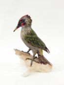 Goebel model of a green woodpecker, printed marks and impressed numbers to base, 28cm high,