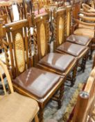 Set of four 20th century oak dining chairs with spirally twisted uprights, hide seats,