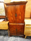 A yew veneered cabinet and a similar cross-banded coffee/magazine table (2)