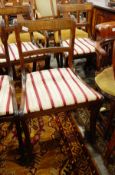 Set of four 20th century dining chairs and two carvers with brass inlaid floral top rail decoration,