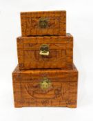 Set of three carved wooden boxes, each of rectangular form, carved with figures and buildings,