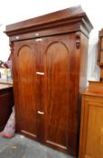 Victorian mahogany double wardrobe, ogee shaped cornice, with round-arch panel doors,