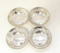 Set of four Edwardian silver nut dishes, each circular with beaded border,
