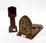 Oak pocket watch stand in the form of a longcase clock and a Victorian oak bookslide with brass