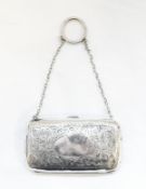 Early 19th century silver lady's evening purse with foliate scrollwork engraving,