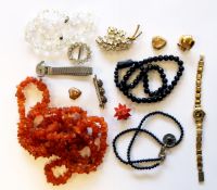 Quantity of costume jewellery to include amber coloured bead necklace,