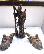 Oriental hardwood carved Japanese figure in tradition dress together with two hardwood carved Water