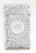 Edwardian silver card case with hinged top, foliate engraving, length 8.