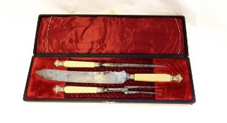 Three-piece steel carving set with ivory handles and white metal mounts,