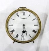 Brass drum-shaped clock with white face and Roman numerals