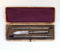 Victorian silver writing set with spiral handles, comprising pen, pencil and paper knife,