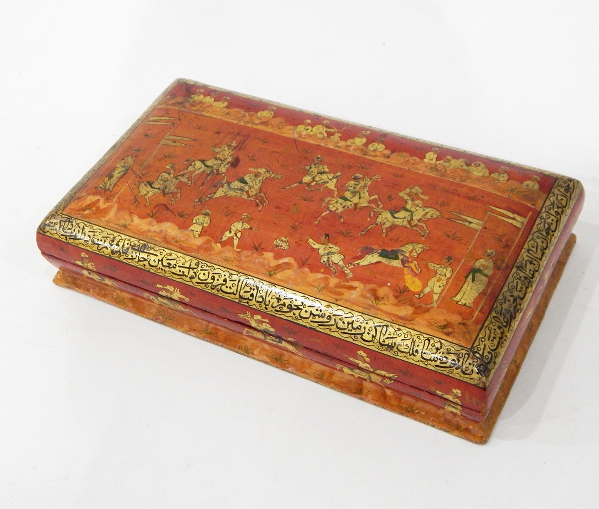Carved hardwood cigarette box, intricately decorated with foliate scrolls,