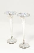 Pair of Edwardian silver trumpet-shaped flower vases with petal-shaped borders,