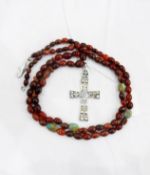 Liberty Amuleti silver cross pendant with bead and wire decoration suspended from a cornelian and