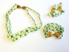 French gilt metal and green bead suite of jewellery to include two strand graduated necklace,