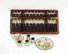 Chinese cloisonne miniature teaset comprising teapot and four mugs on circular tray,