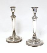 Pair of EPNS candlesticks with tapering supports,