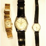 Travelling alarm clock in a leather case, four wristwatches,