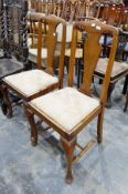 Set of four 20th century mahogany dining chairs with vase-shaped splats, on shaped supports,