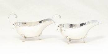Pair George V silver sauceboats, each oval with ribband and thread borders,