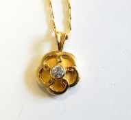 18ct gold and diamond solitaire flowerhead pendant, the centre set stone approx. 0.