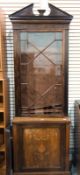 Edwardian mahogany display cabinet with broken arched pediment and dentil moulding,