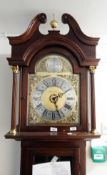 A reproduction mahogany longcase clock, the hood with swan neck pediment,