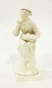 Modern white porcelain model of a lady with a basket of flowers, seated on a pillar,