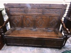 18th century oak bench settle with floral and scroll top rail and frieze,