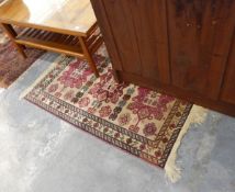 A Persian style rug,