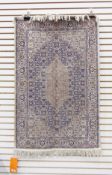 An Eastern silk rug foliate decorations ,