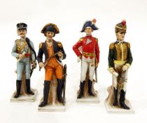 Set of four continental porcelain figures of Napoleonic soldiers, each on square bases,