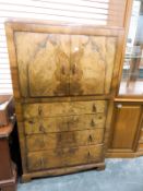 Art Deco walnut veneered cabinet over four graduated drawers, on shaped bracket feet,