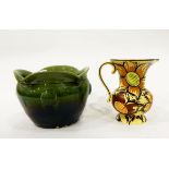 Art pottery vase decorated with brown flowers on a yellow ground,