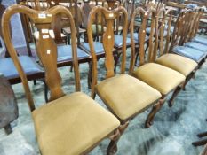 Set of four Queen Anne style reproduction walnut armchairs with green velvet seats,