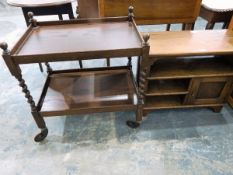 Modern oak telephone table with undershelf and cupboard together with a two-tier tea trolley on