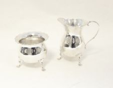Silver cream jug and sugar basin, each piece with serpentine everted rim, baluster body,