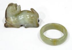 Carved Oriental jade model of a temple dog and a jade child's bangle (cracked) (2)