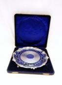 George V silver salver with fluted and scroll serpentine border, engine-turned band to the centre,