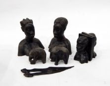 Pair of African carved hardwood busts of women, a pair of bookends, elephant ornaments, etc.