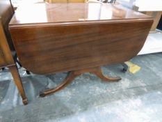 Mahogany fall-flap dining table supported on shaped standards,