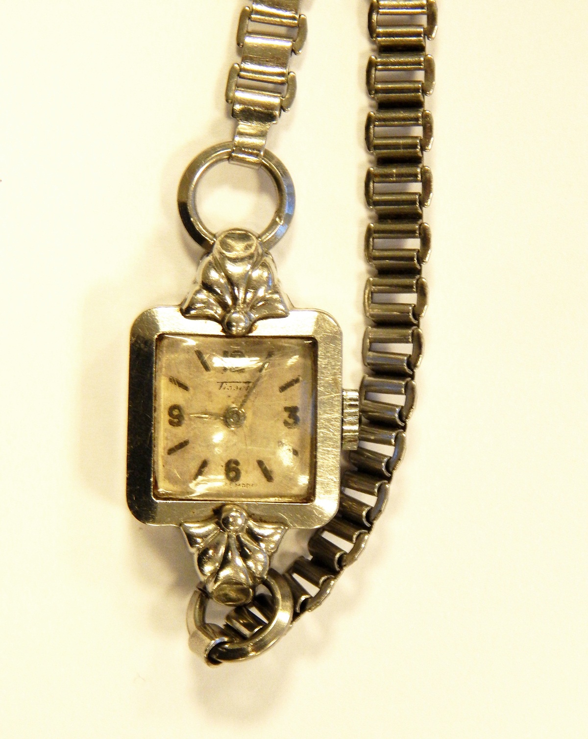Tissot lady's evening watch with silvered square dial and chain bracelet