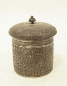 A Burmese or Indian silver circular lidded box, foliate scroll engraved, 6.