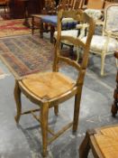 Set of six matching French-style dining chairs with rush seats