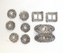 Pair of belt buckles, six matching buttons and two further buckles,