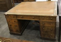 Victorian oak partner's pedestal desk with an arrangement of nine short drawers to each side,
