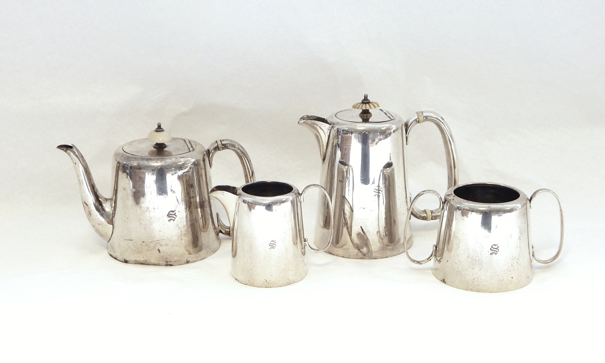 George V silver four piece teaset comprising teapot, hot water jug, milk jug and sugar bowl,