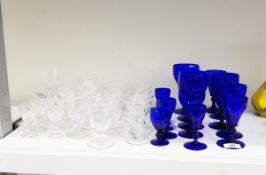Part suite of blue glass drinking glasses, all with bucket bowls,