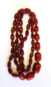 Red amber style graduated bead necklace with oval beads,