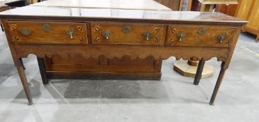 18th century oak dresser, three drawers with box and ebony stringing, fan-shaped corners,